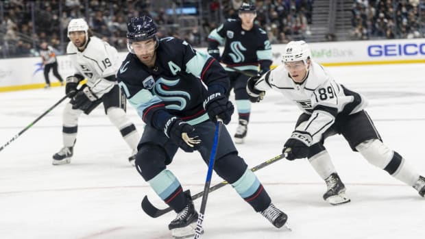 Jan 15, 2022; Seattle, Washington, USA; Seattle Kraken right wing Jordan Eberle (7) skates with the puck ahead of Los Angeles Kings center Rasmus Kupari (89) during the third period at Climate Pledge Arena. Mandatory Credit: Stephen Brashear-USA TODAY Sports